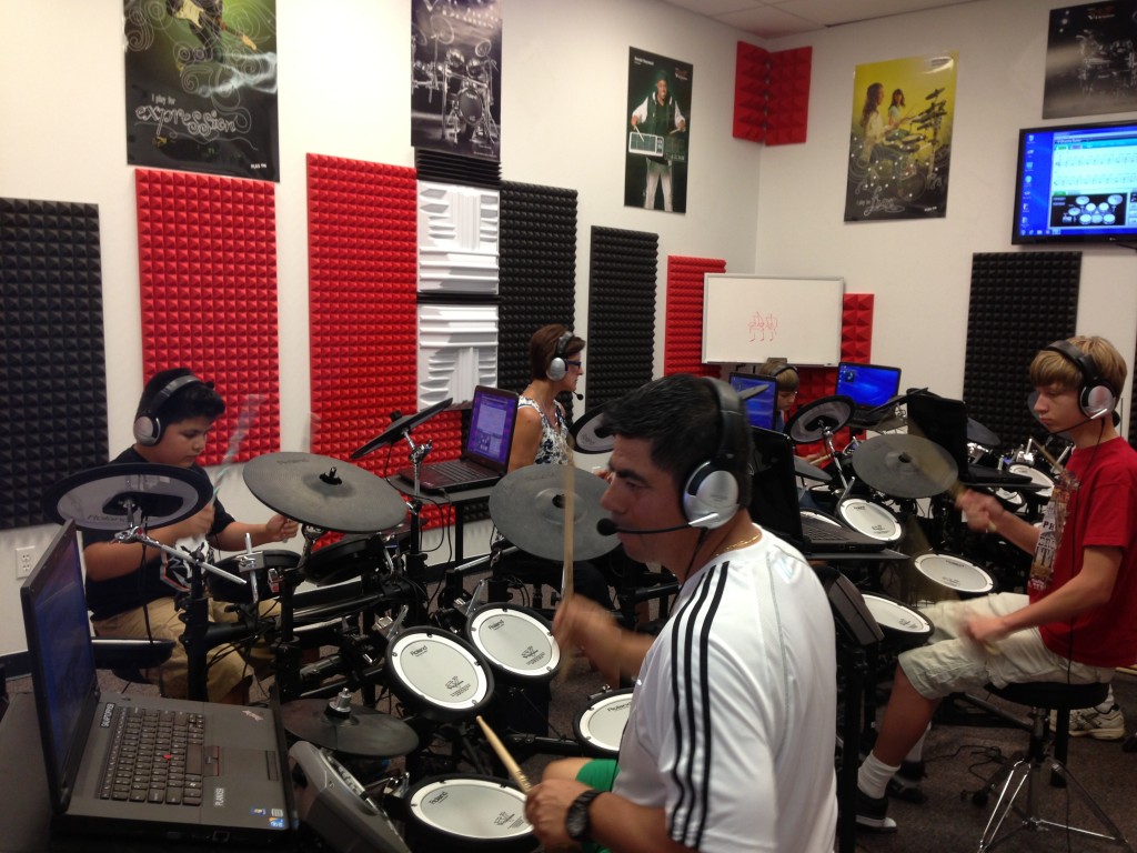 Students at Sam Ash V drum lab